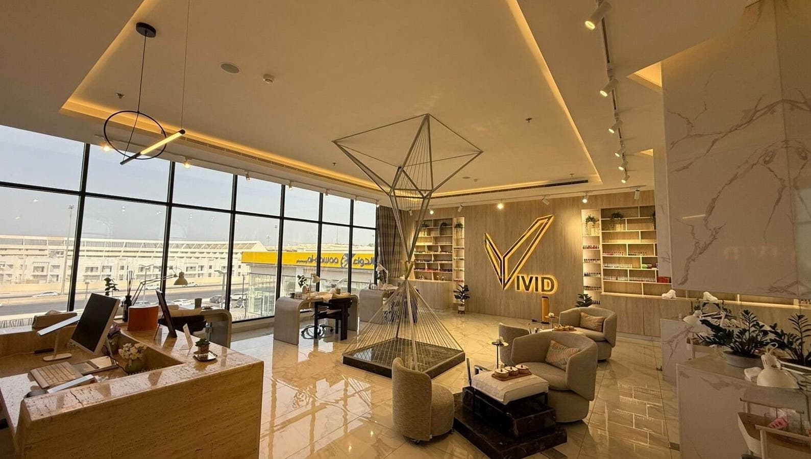 Elegant lobby of Vivid Fitness and Spa in Al Khobar, Eastern Province, SA, featuring modern decor and seating.