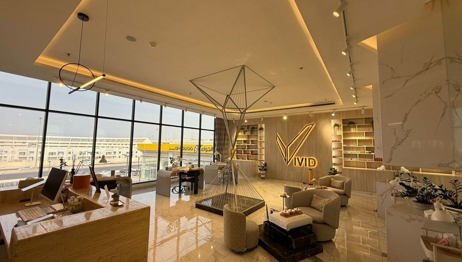 Elegant lobby of Vivid Fitness and Spa in Al Khobar, Eastern Province, SA, featuring modern decor and seating.