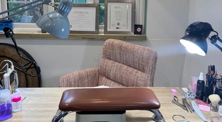 Nail studio setup at By Char Nails, Writtle, England, GB with tools and certificates displayed.