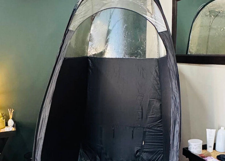 Cozy spray tan booth at Glow Tan Spray Tan Salon in Olifantsfontein, Gauteng, ZA, creating a warm, inviting ambiance.