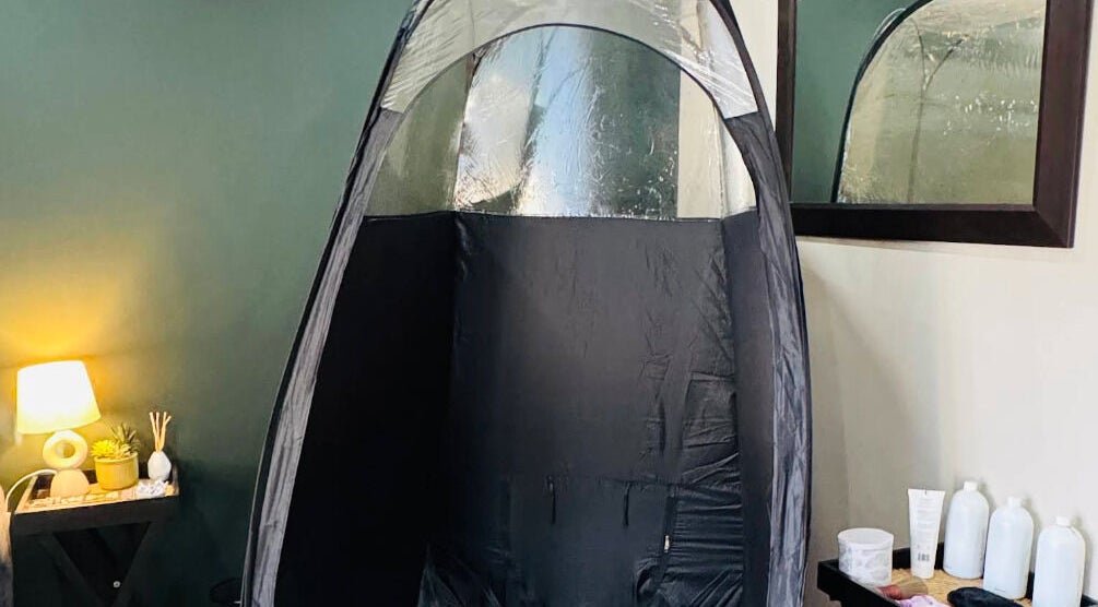 Cozy spray tan booth at Glow Tan Spray Tan Salon in Olifantsfontein, Gauteng, ZA, creating a warm, inviting ambiance.