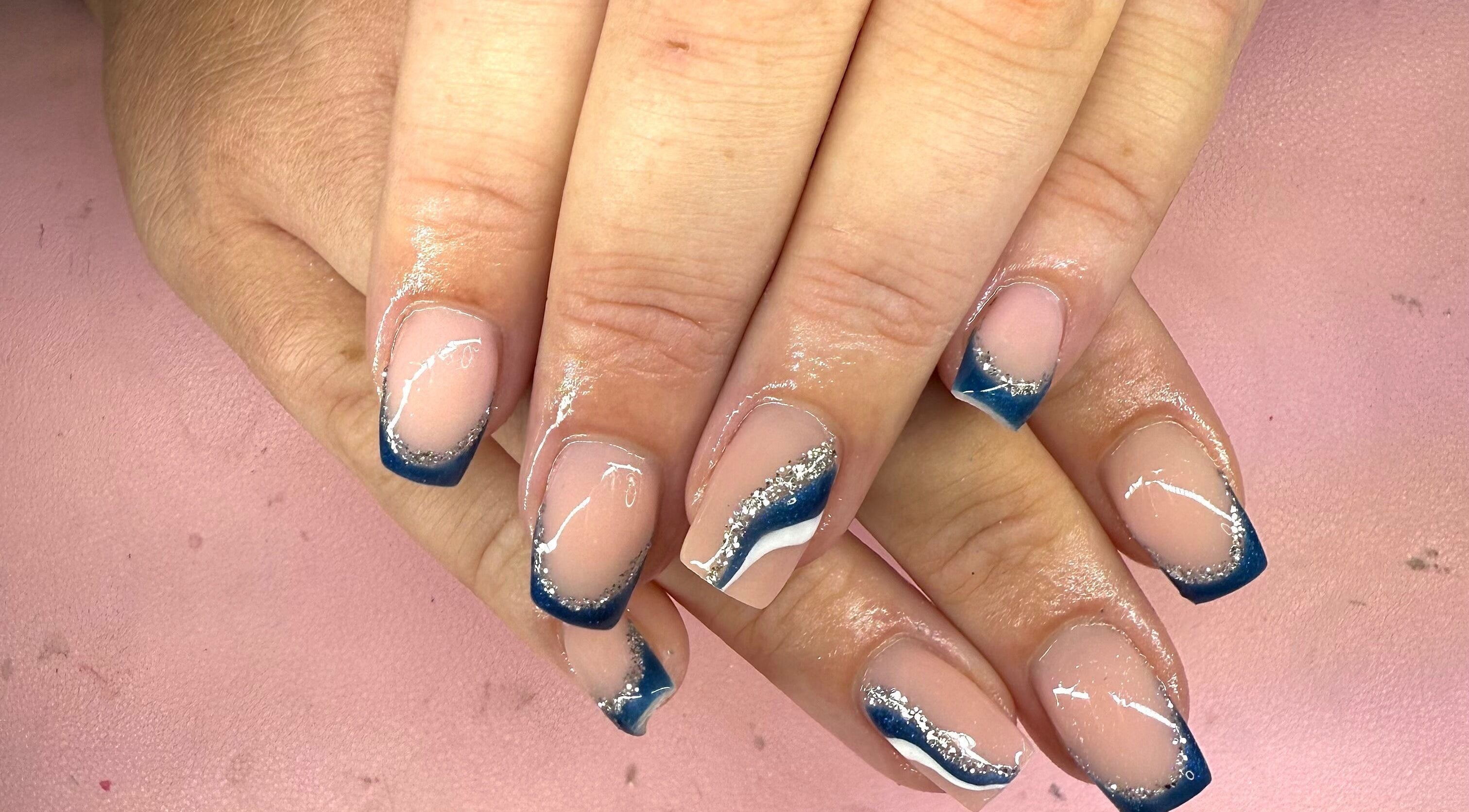 Elegant blue and silver nail design at Shannon lea Beauty and Nails, Ashton-in-makerfield, England, GB.
