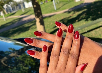 Elegant red manicure at Nails by Faith, offers chic nail art in Cape Town, Western Cape, ZA.