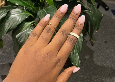 Manicured hand with elegant rings at Nails by Faith, Cape Town, Western Cape, ZA.