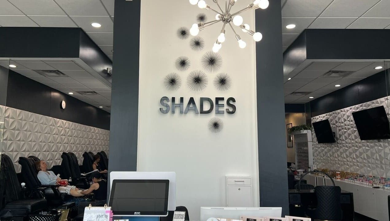 Interior of Shades Nail Bar in Worthington, Ohio, US showcasing chic decor and serene atmosphere.