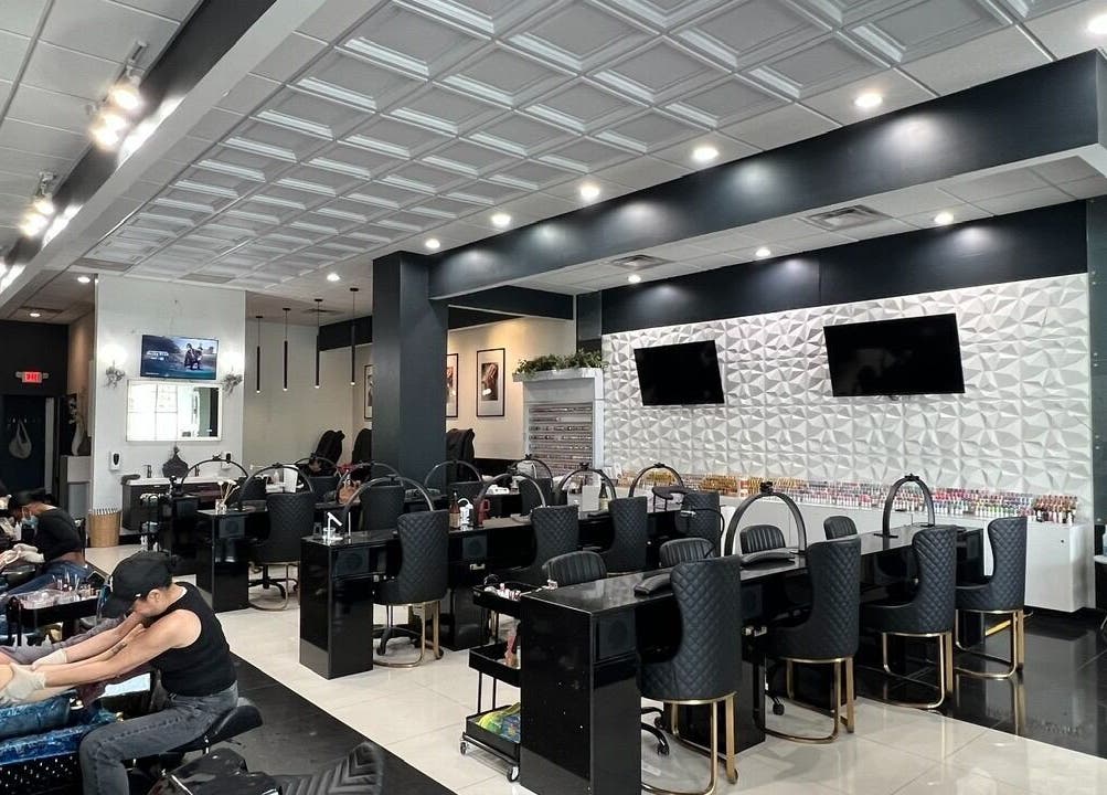 Modern interior of Shades Nail Bar in Worthington, Ohio, US, showcasing elegant nail service stations.