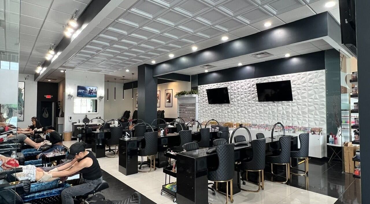 Modern interior of Shades Nail Bar in Worthington, Ohio, US, showcasing elegant nail service stations.