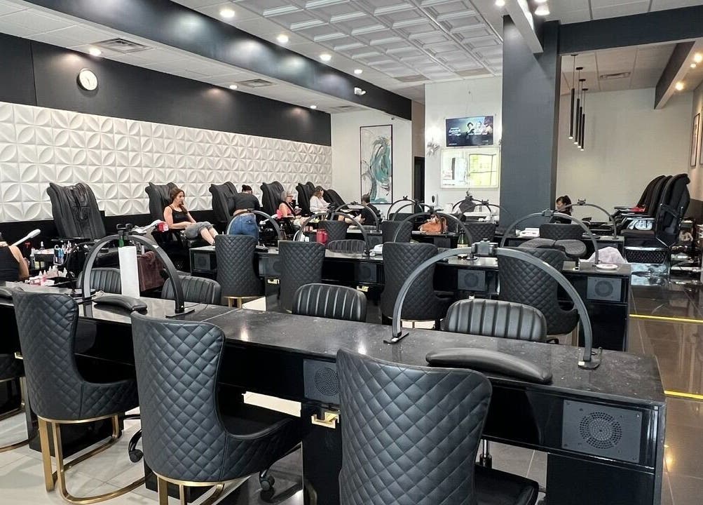 Chic interior of Shades Nail Bar in Worthington, Ohio, US, showcasing luxurious nail stations and comfortable seating.