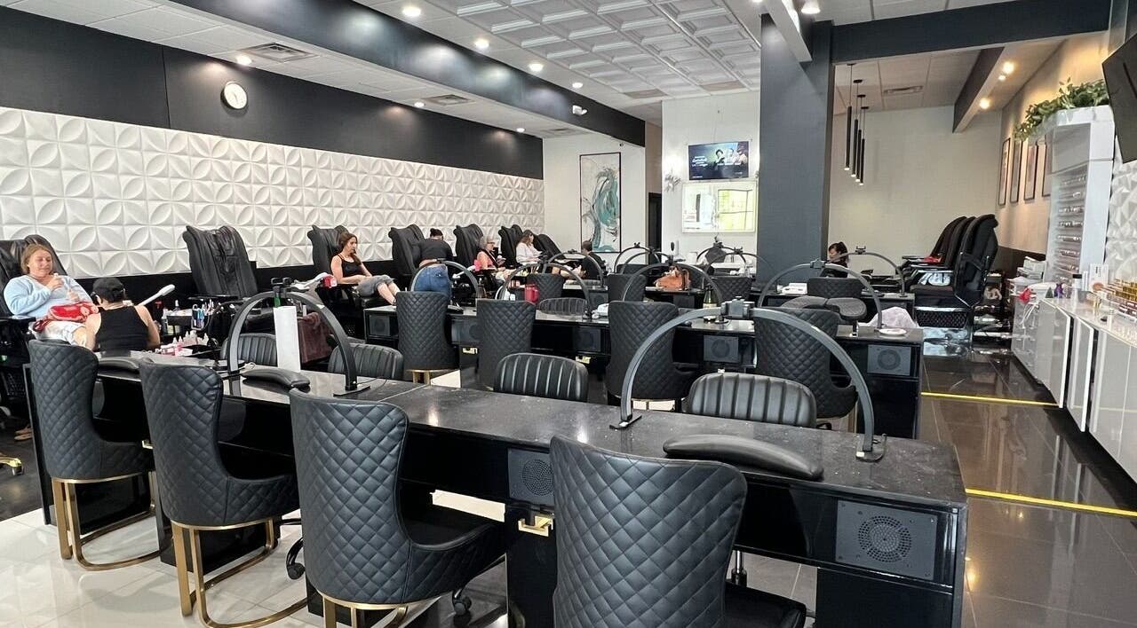 Chic interior of Shades Nail Bar in Worthington, Ohio, US, showcasing luxurious nail stations and comfortable seating.