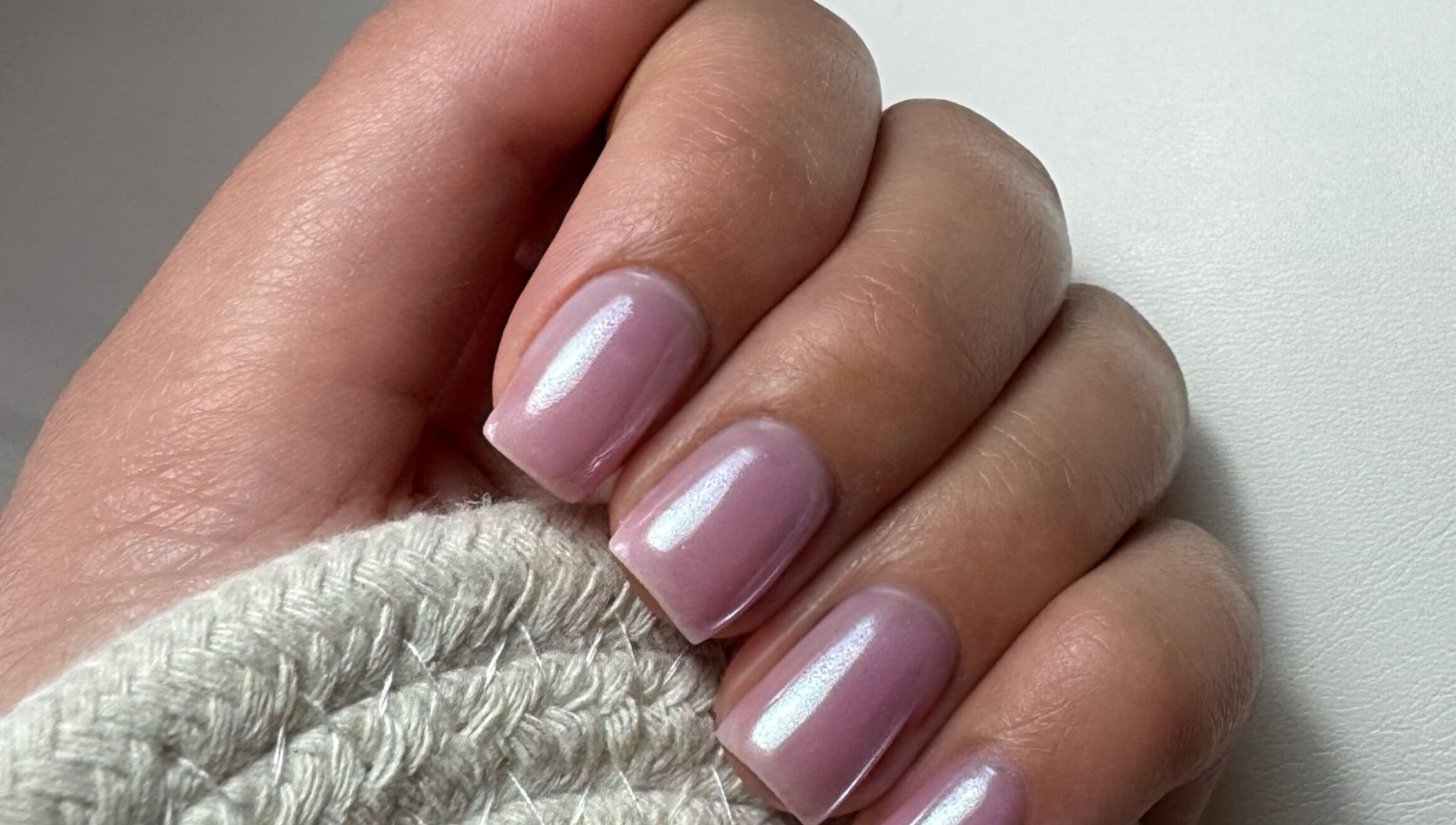 Elegant pink manicure at Luxe Nails Lounge, Southend-on-sea, England, GB, showcasing expert craftsmanship.