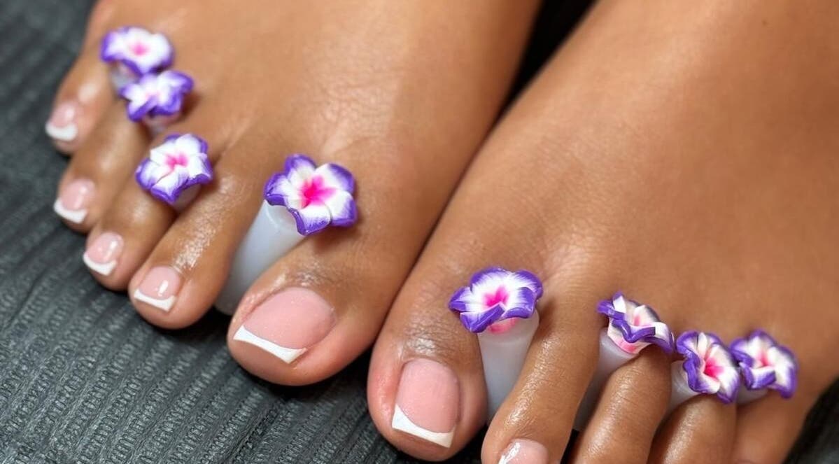 Elegant floral pedicure at Luxe Nails Lounge in Southend-on-sea, England, GB showcasing pristine nail art.