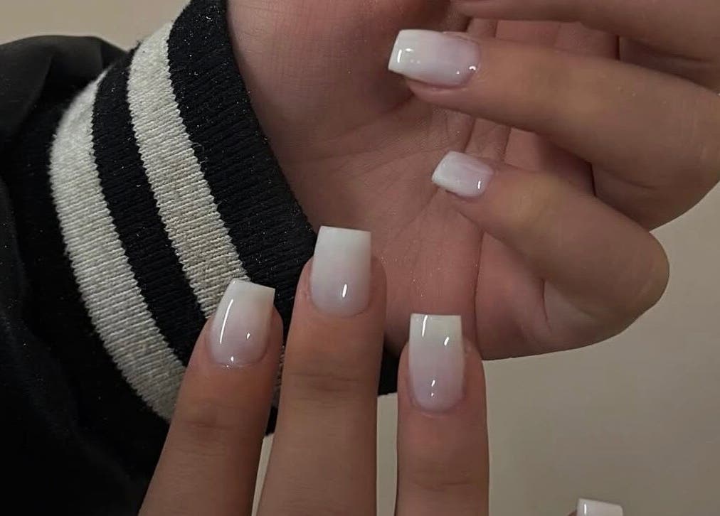 Stylish white acrylic nails at Luxe Nails Lounge, Southend-on-sea, England, GB.