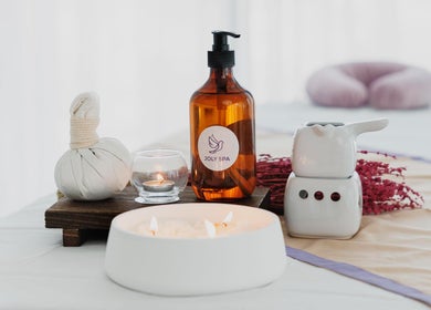 Relaxing spa setup at Joly Spa - Home Service, Riyadh, Riyadh Province, SA with candles and spa oils.