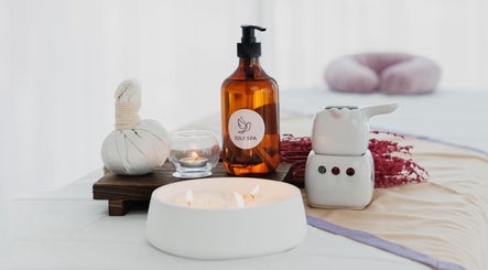 Relaxing spa setup at Joly Spa - Home Service, Riyadh, Riyadh Province, SA with candles and spa oils.