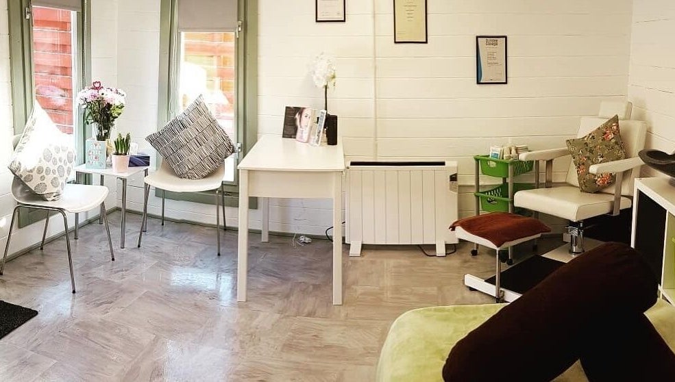 Inviting reception area at Beauty by Amy Bennett in Blackburn, Scotland, GB with modern seating and decor.