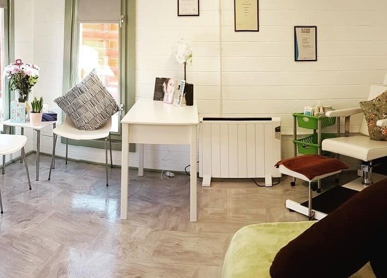 Inviting reception area at Beauty by Amy Bennett in Blackburn, Scotland, GB with modern seating and decor.