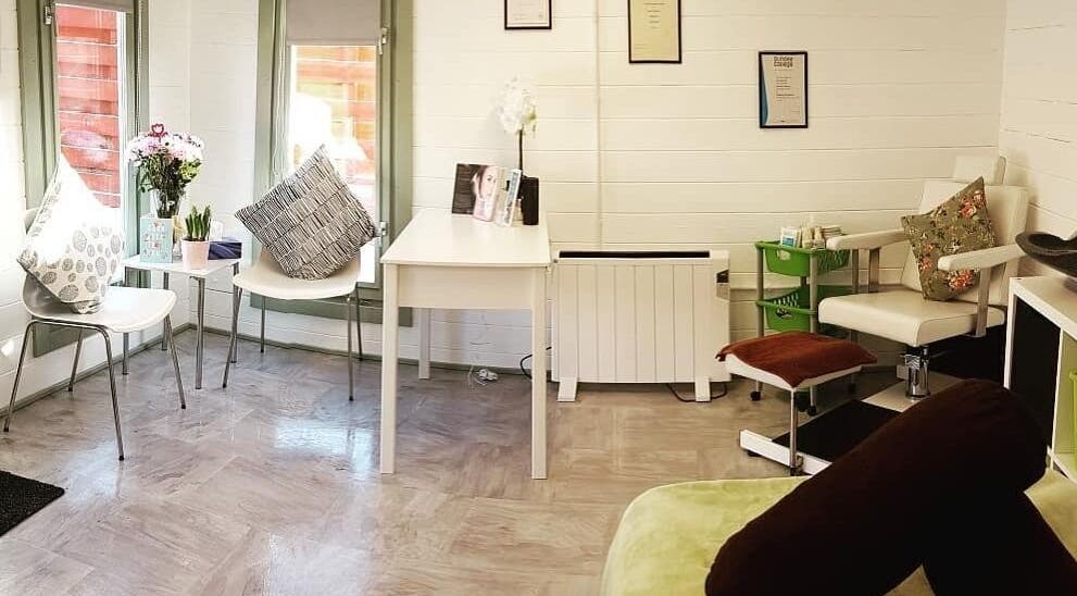 Inviting reception area at Beauty by Amy Bennett in Blackburn, Scotland, GB with modern seating and decor.