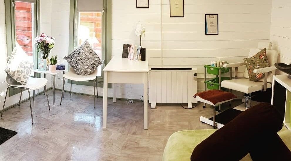 Inviting reception area at Beauty by Amy Bennett in Blackburn, Scotland, GB with modern seating and decor.