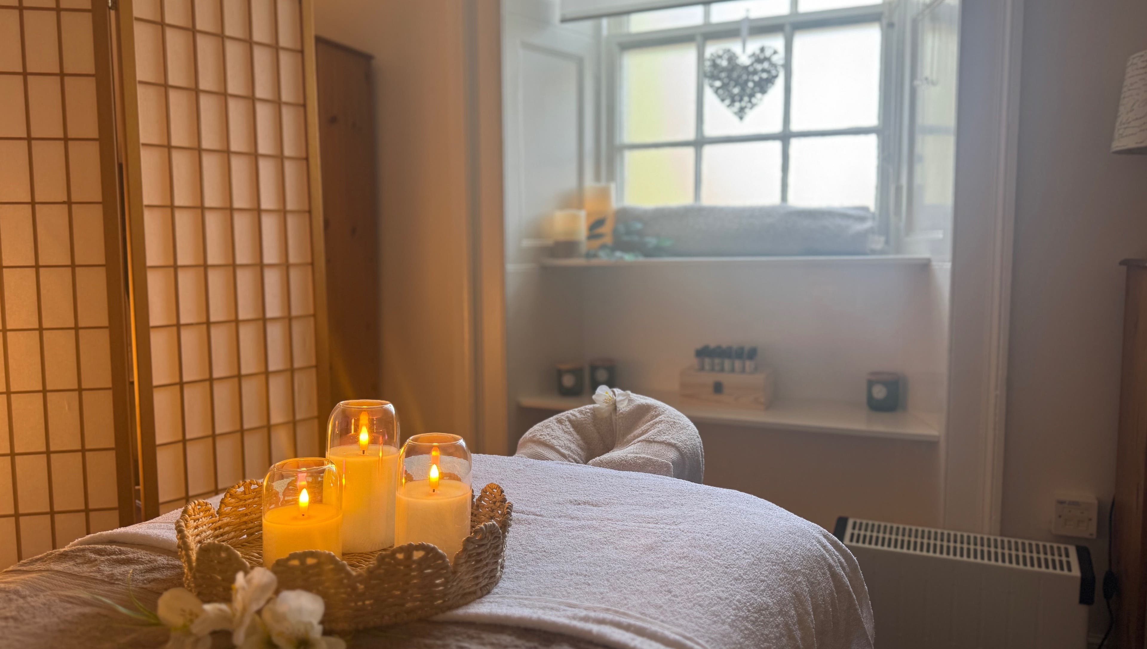Candlelit massage room at Dream Complementary Therapy, Elgin, Scotland, GB, creating a calming ambiance.