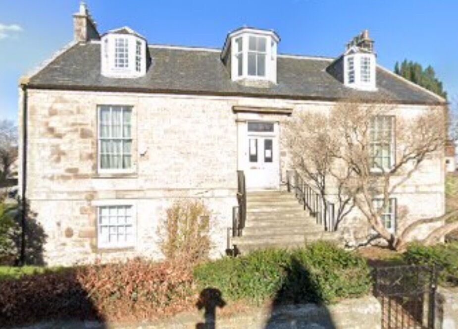 Exterior of Dream Complementary Therapy in Elgin, Scotland, GB, showcasing a quaint stone building and serene surroundings.