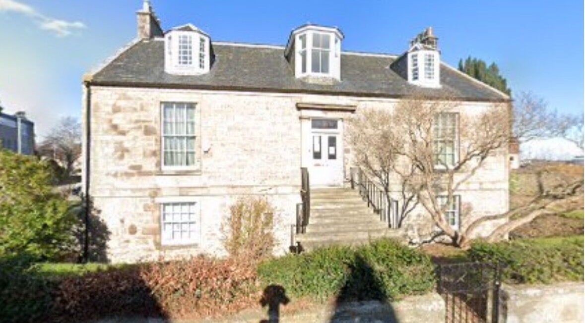 Exterior of Dream Complementary Therapy in Elgin, Scotland, GB, showcasing a quaint stone building and serene surroundings.