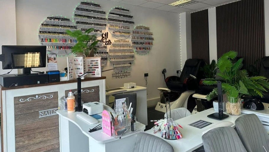 Elegant interior of Ellas Beauty in Grimsby, England, showcasing nail polish display and modern salon setup.