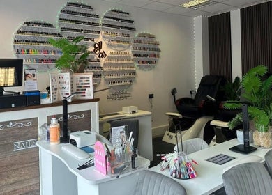 Elegant interior of Ellas Beauty in Grimsby, England, showcasing nail polish display and modern salon setup.