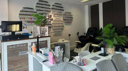 Cozy interior of Ellas Beauty Grimsby, featuring nail polish display and comfy seating in Grimsby, England, GB.