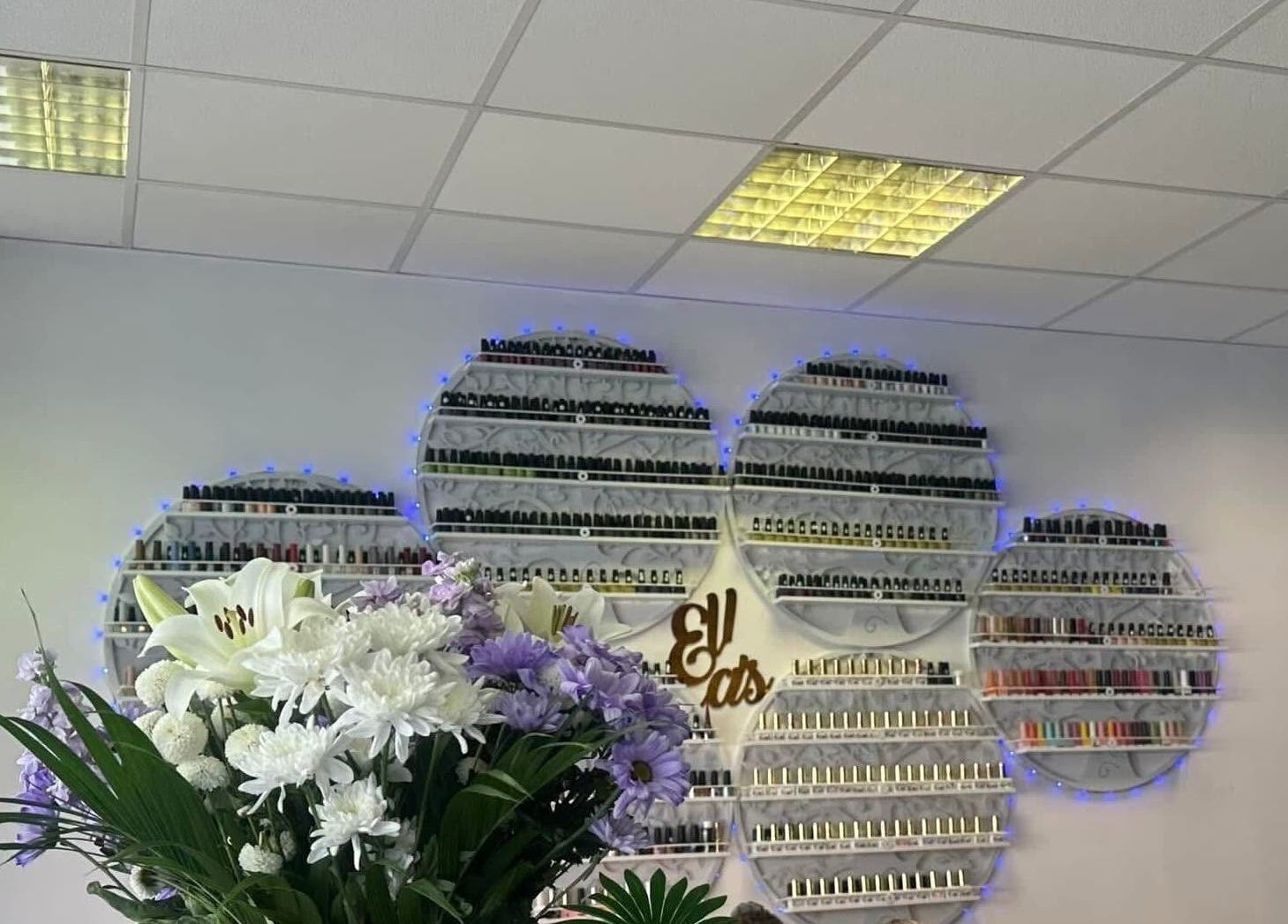 Elegant nail polish display at Ellas Beauty Grimsby, Grimsby, England, GB with floral decor enhancing the ambiance.
