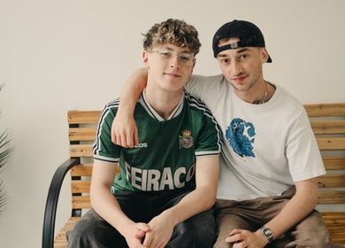 Two relaxed friends seated at Wakes Barbershop, Newquay, England, GB, highlighting a welcoming vibe.