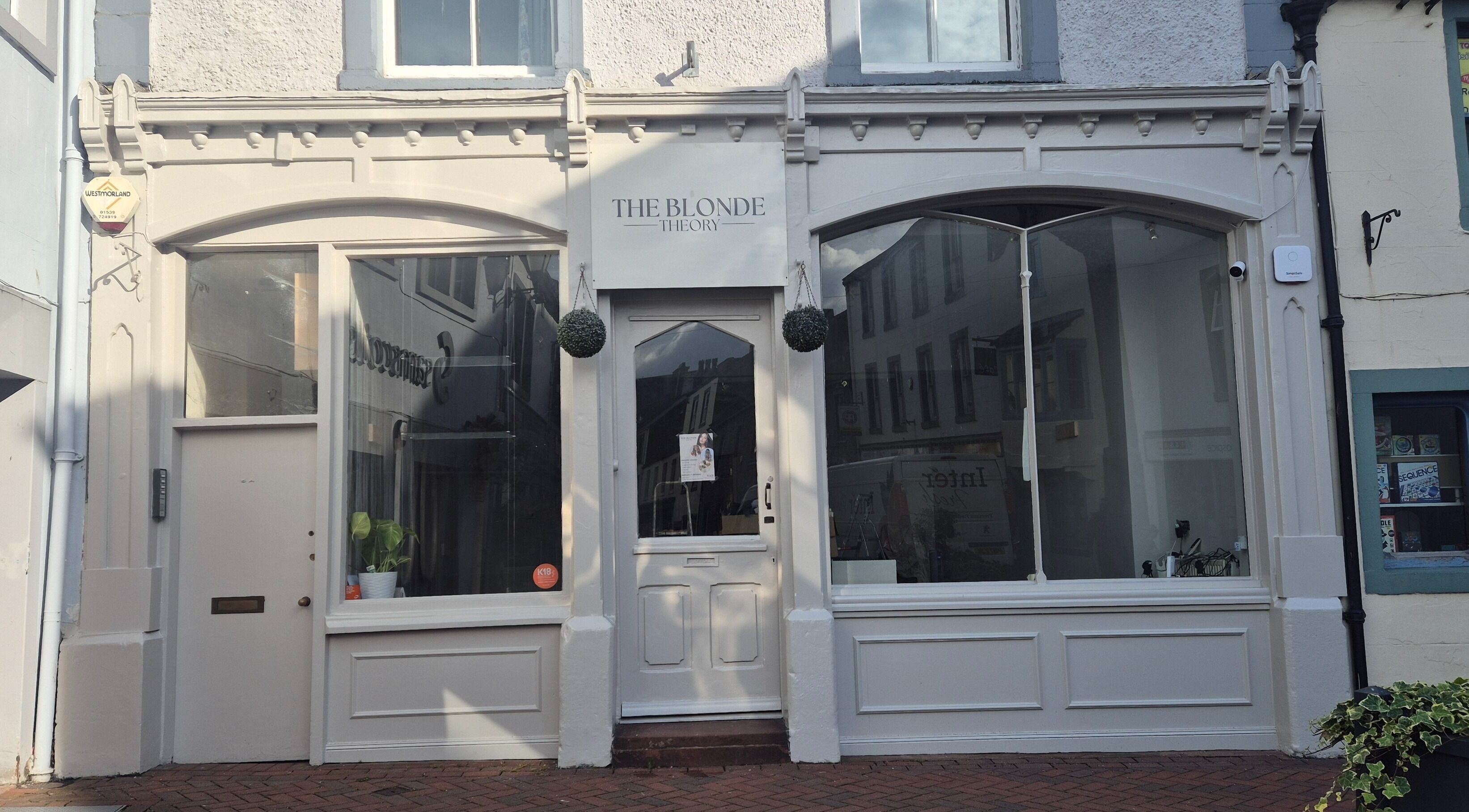 Front view of The Blonde Theory, a chic beauty venue in Penrith, England, showcasing elegant white decor.