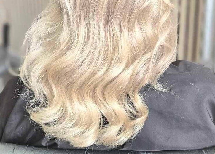 Blonde wavy hair styled at The Blonde Theory, Penrith, England, GB, showcasing salon expertise.