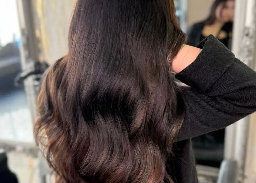 Luxurious brunette hair styled at The Blonde Theory, Penrith, England, GB. Experience premium salon care.