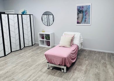 Relaxing treatment room at Smooth Skin Clinic, Esperance, Western Australia, AU, featuring a cozy pink bed.