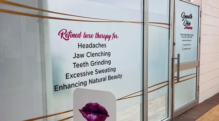 Smooth Skin Clinic front glass door in Esperance, WA, offering luxe therapy for beauty and wellbeing.