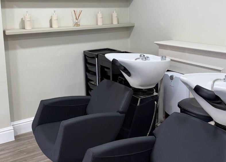 Modern wash stations at Paul at The Blonde Society in Bramhall, England, GB, offering luxury haircare.
