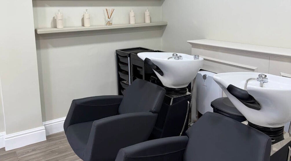 Modern wash stations at Paul at The Blonde Society in Bramhall, England, GB, offering luxury haircare.