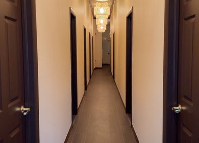 Hallway of Mizu Spa Massage - Delray Beach, featuring softly lit lamps, in Delray Beach, Florida, US.
