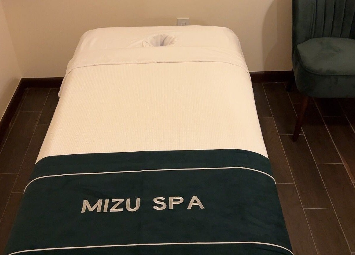 Massage table at Mizu Spa Massage - Delray Beach, Delray Beach, Florida, US with plush surroundings.