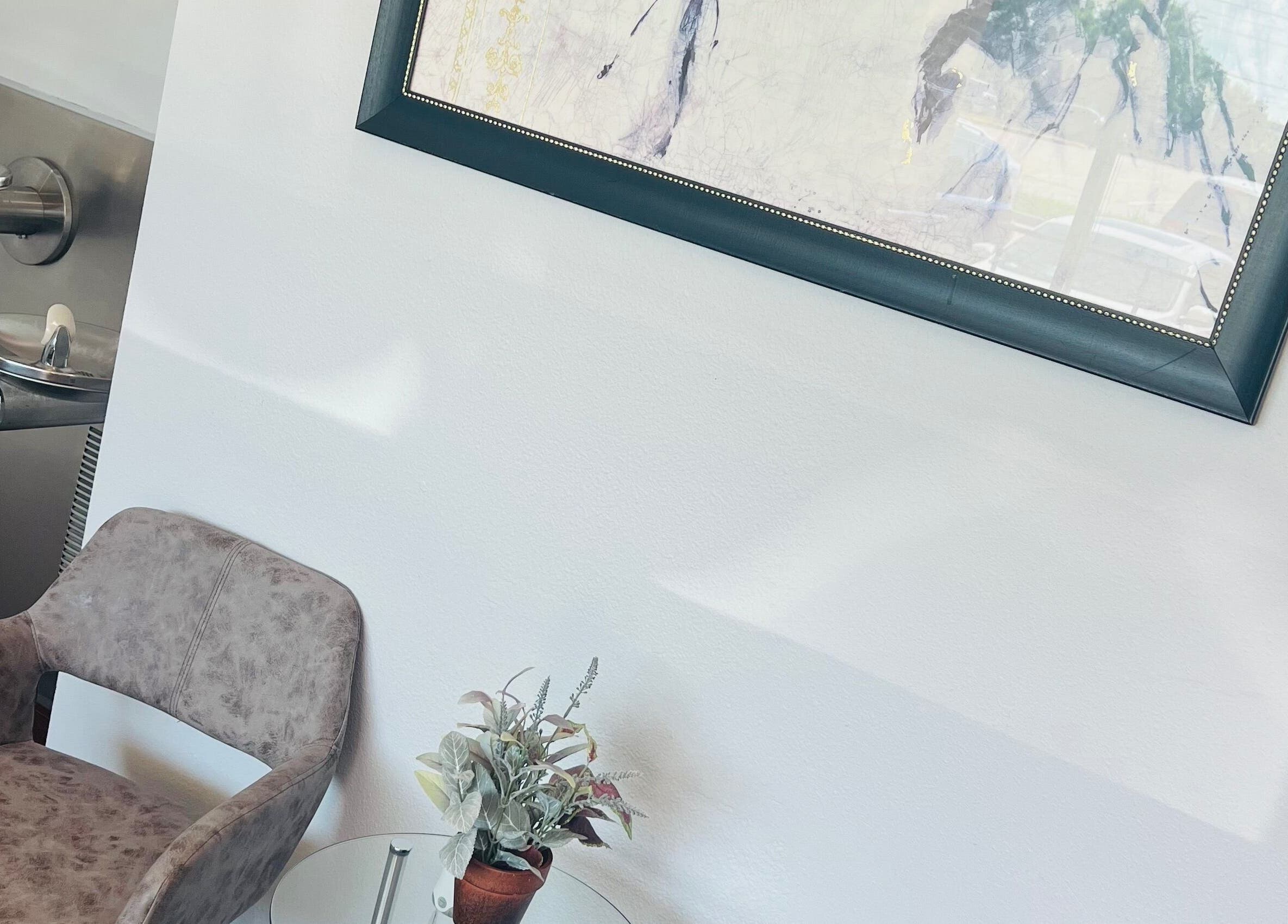 Relaxing seating area at Key Hair Hands, Plano, Texas, US with modern decor and soothing ambiance.