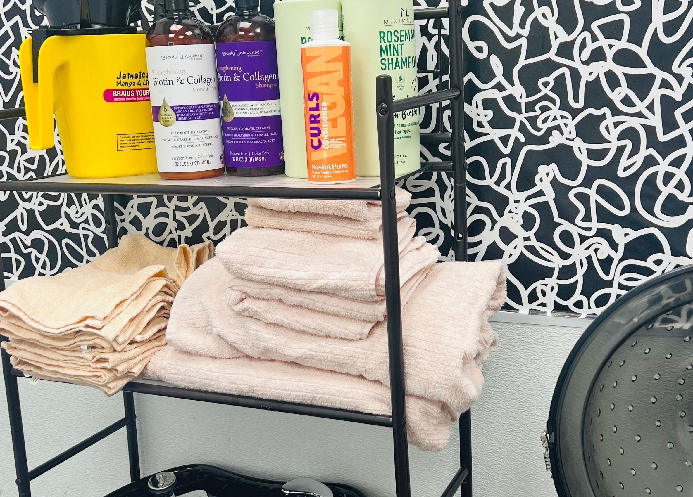 Key Hair Hands salon supplies neatly arranged in Plano, Texas, US, offering premium hair care products and towels.