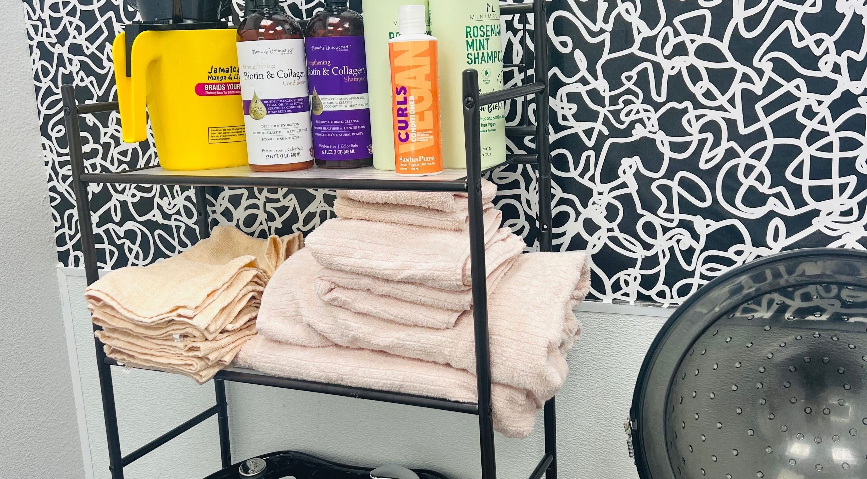 Key Hair Hands salon supplies neatly arranged in Plano, Texas, US, offering premium hair care products and towels.