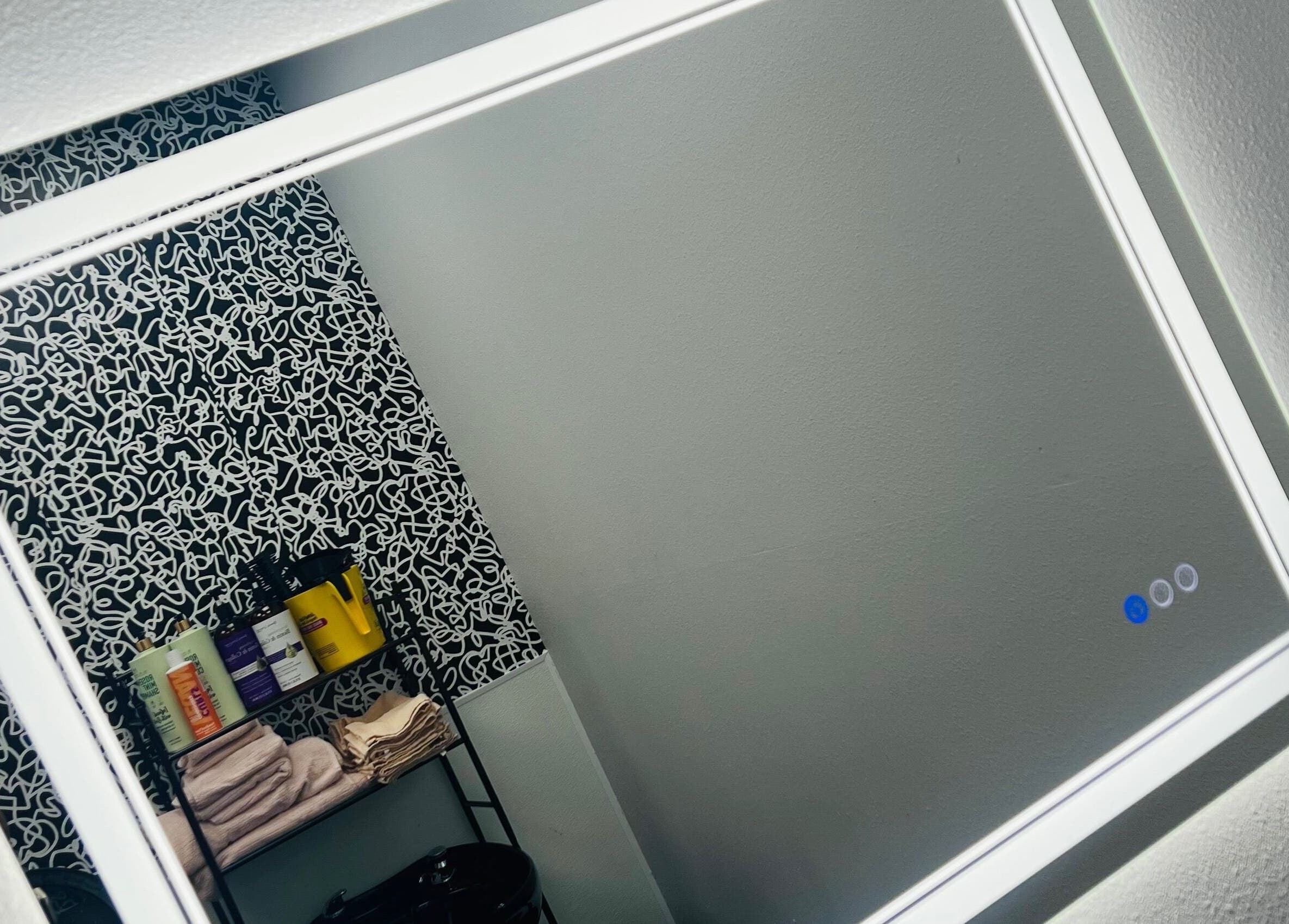 Stylish mirror and product display at Key Hair Hands, Plano, Texas, US.