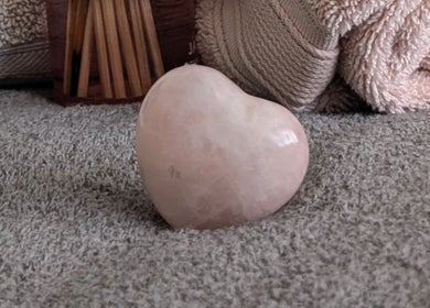 Heart-shaped stone at Rekas holistic massage, Woking, England, GB, embodies tranquility and relaxation.
