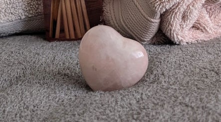 Heart-shaped stone at Rekas holistic massage, Woking, England, GB, embodies tranquility and relaxation.