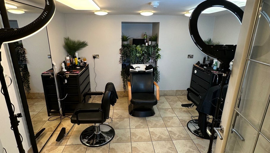 Modern salon space in NO BRAND, Dublin, County Dublin, IE featuring chairs, mirrors, and lush greenery.