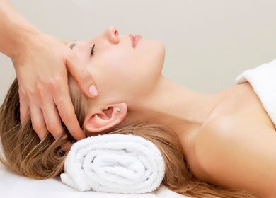 Relaxing head massage at Elysium Esthetics in Westport, Ontario, CA, offering rejuvenating wellness services.