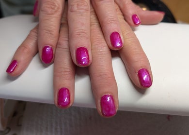 Vibrant pink manicured nails at Nailed It Yate, Yate, England, GB showcasing expert nail art.