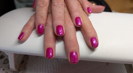 Vibrant pink manicured nails at Nailed It Yate, Yate, England, GB showcasing expert nail art.