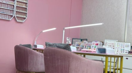 Chic nail stations at Aurora Beauty Women Salon, Dubai, AE showcasing vibrant polish displays.